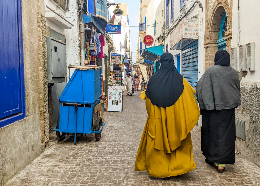 local women walking through Essaouira medina